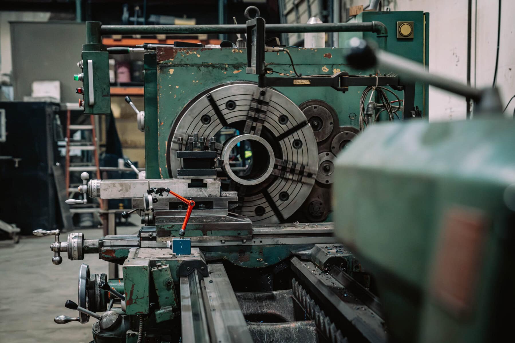 Industrial lathe machine at Wesco Machine Works for precision manufacturing.
