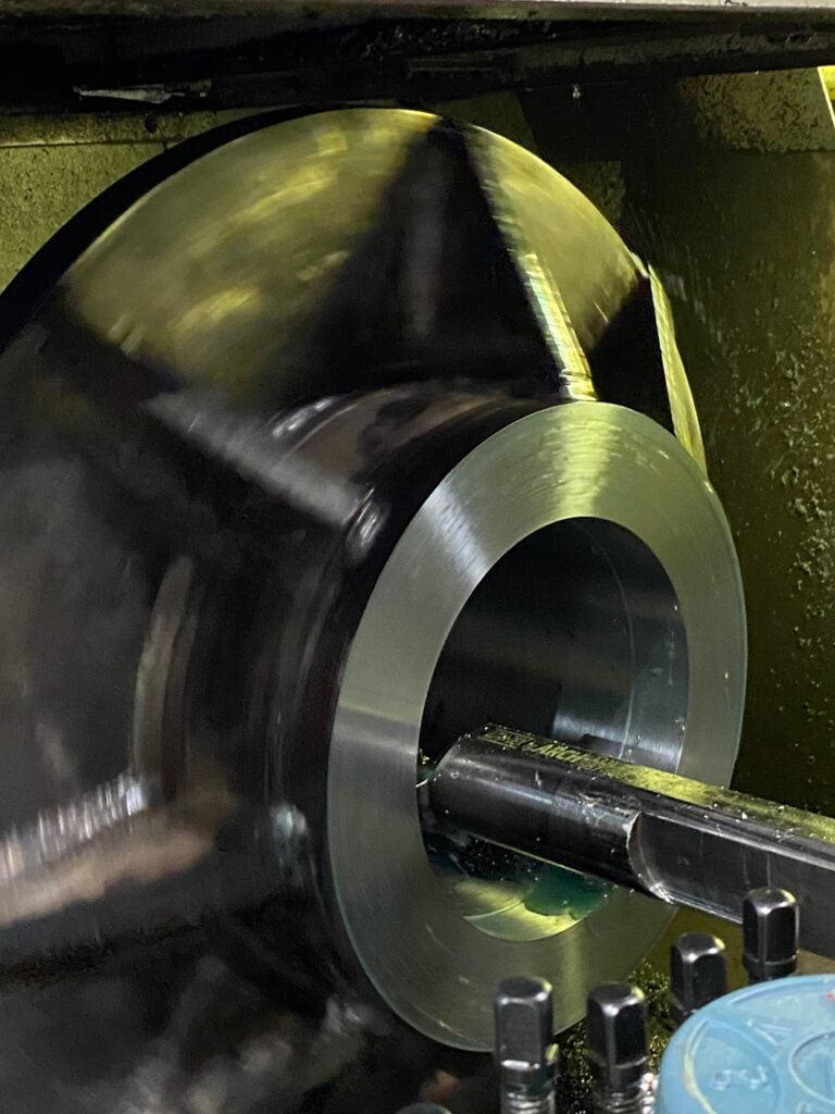 CNC machining process at Wesco Machine Works, showcasing high-precision metal turning and milling.