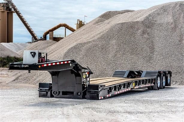 Heavy-duty industrial flatbed trailer for construction and transport.