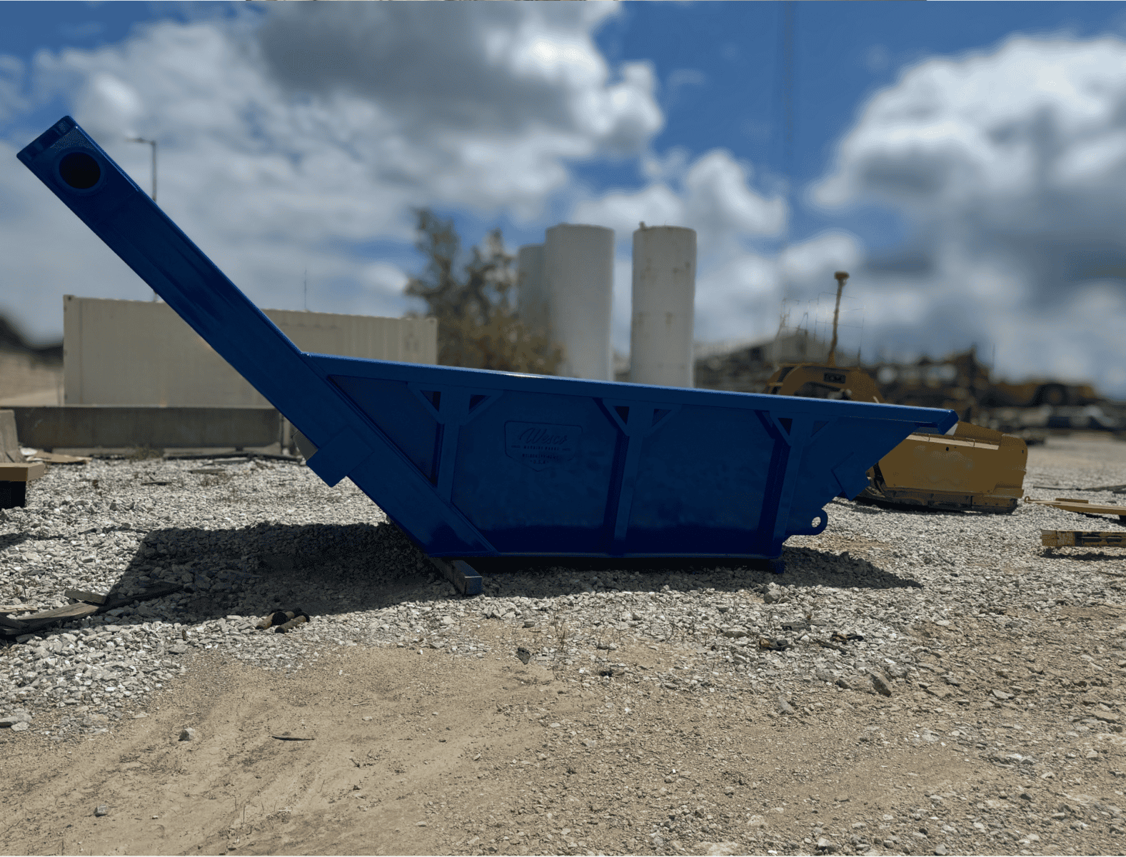 Industrial container for construction site use, blue color, heavy-duty steel construction.