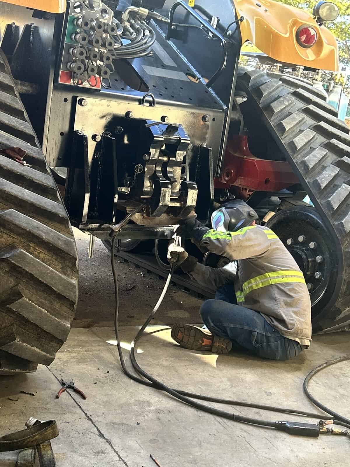 Tractor maintenance and repair by Wesco Machine Works, specializing in heavy machinery and agricultu.