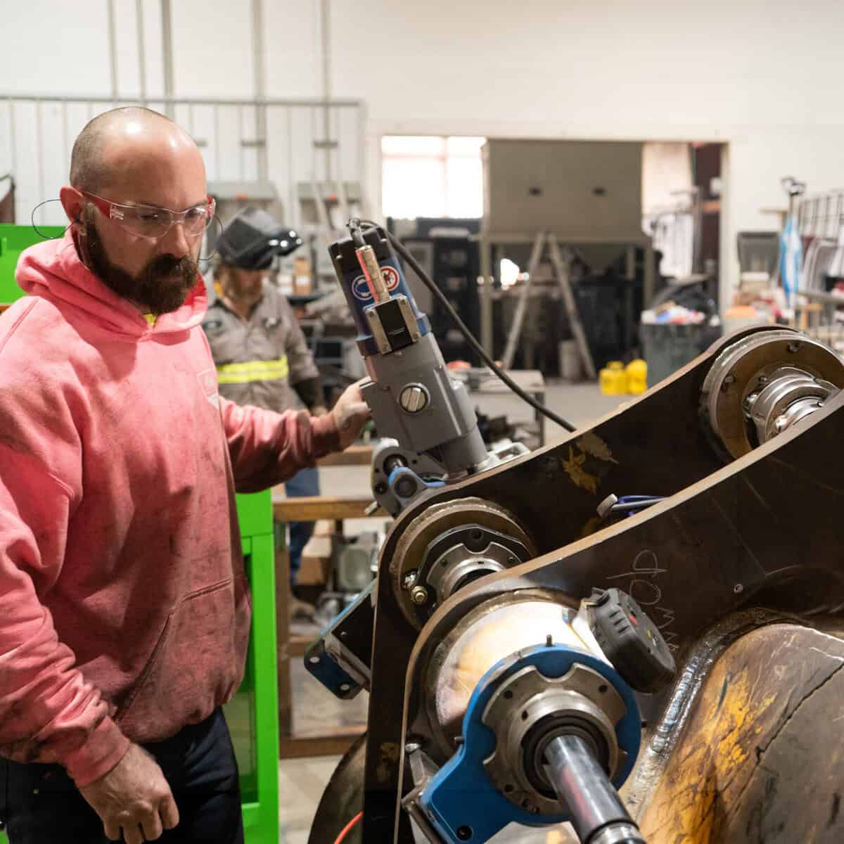 Skilled worker operating industrial machinery at Wesco Machine Works.